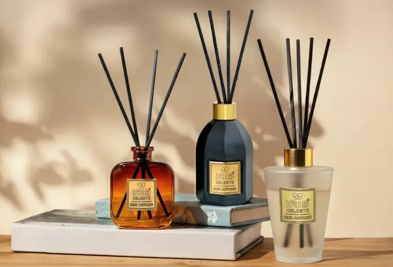 IRIS Celeste reed diffuser trio styled on stacked books